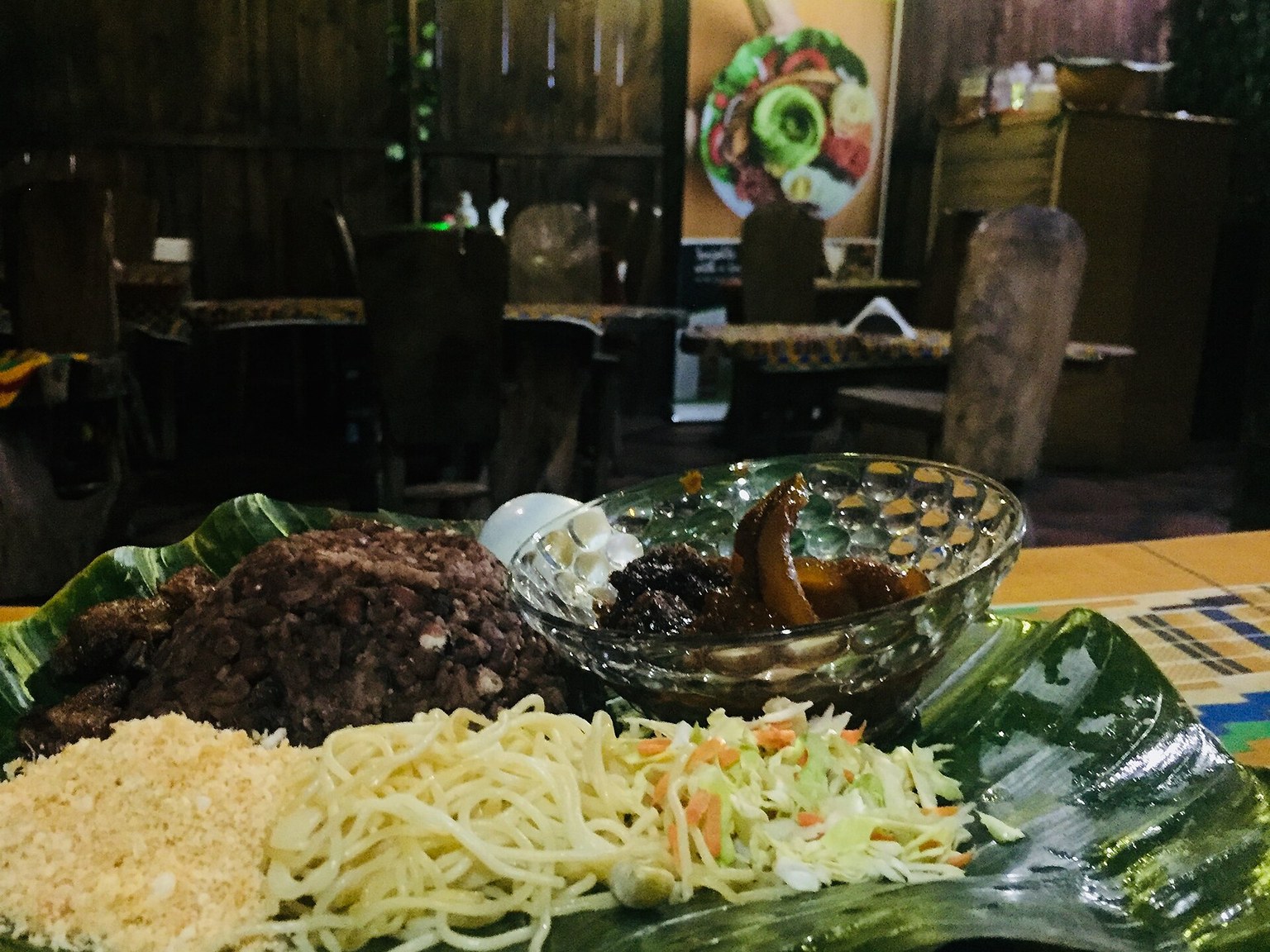 A real serving of Ghanaian waakye with rice and beans, spaghetti, gari, egg, stew and salad